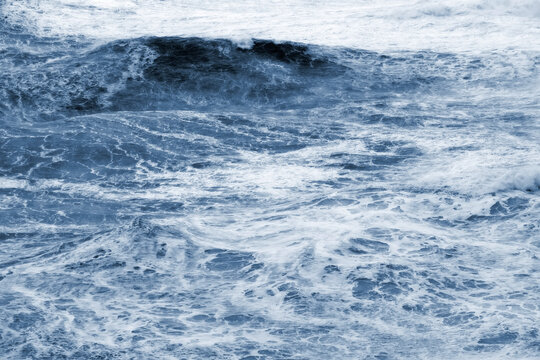 giant waves breaking on a stormy day in atlantic sea ocean