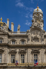 Obraz premium Architectural fragments of the Lyon City Hall building (Hotel de Ville, from 1672) - one of the largest historic buildings in the city on Place des Terreaux. Lyon, France.