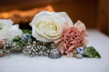 White or yellow rose with an orange rose with babies breath with engagement ring or engagement ring