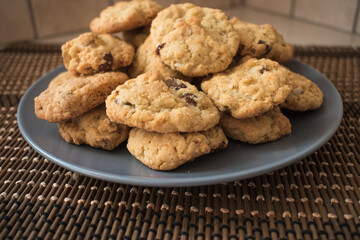 Tasty chocolate chips cookies in a grey plate