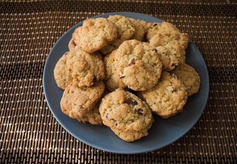 Tasty chocolate chips cookies in a grey plate