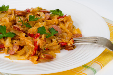 Stewed vegetables, cabbage, paprika with sausages