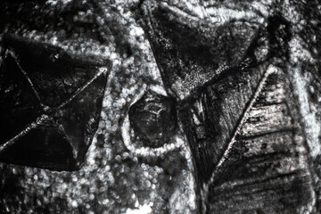 Amazing salt crystal close up under the light microscope. Grown crystal of table salt