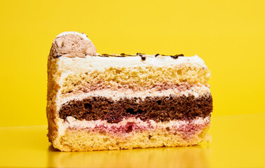 Tasty birthday cake sliced sweet food side view