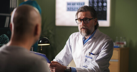 Oncology patient meeting with doctor in clinic