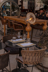 Autentic table with chairs in vintage caffe outside.