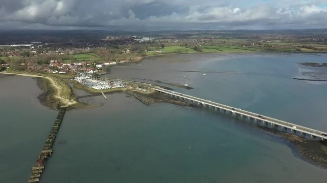 Langstone Sailing Club aerial with the road bridge and the old railway bridge to Hayling Island in view.