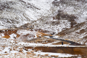 Unrecognized people at the Gunnuhver Geothermal field at Reykjanes Peninsula in Iceland