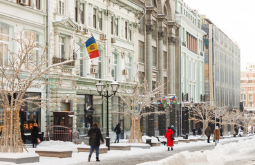 Moscow, Russia, Jan 15, 2021: Pedestrian zone at Kuznetsky most street. Embassy of  Moldova. Street full of snow. New year decorations