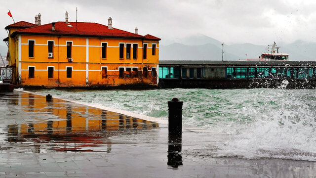 old yellow pier and waves