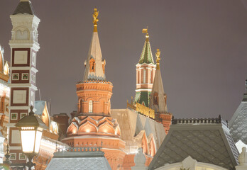 Moscow, Russia.  Evening photo of towers of The Kremlin and State Historical Museum. Shot in long focal length with compressed perspective