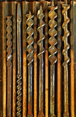 rusty wood drills in a box
