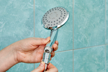 Connecting new flat shower head to flexible hose.