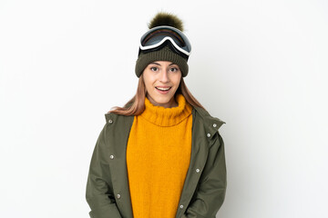 Skier caucasian woman with snowboarding glasses isolated on white background with surprise facial expression