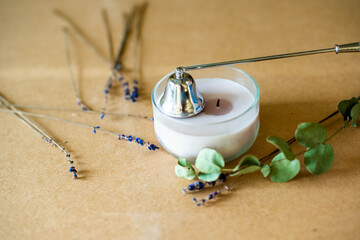 Tools for making candles of white soy wax flakes, essential oil, wicks on pergament background....