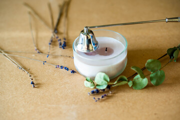 Tools for making candles of white soy wax flakes, essential oil, wicks on pergament background....