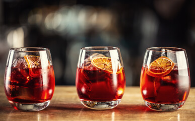 Negroni classic cocktail and gin short drink with sweet vermouth, red bitter liqueur and dried...
