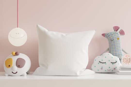 Mockup pillow in the children's room on light pink colors wall background.
