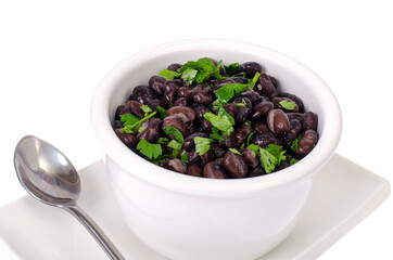 Dark red canned beans in white bowl