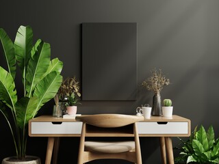 Mockup black frame on work table in living room interior on empty dark wall background.