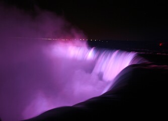 Scenic View Of Waterfall Against Sky At Night