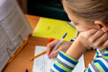 Close-up of a girl doing homework