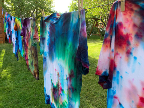 Tye Dye T-shirts Hanging on. Clothesline to Drye