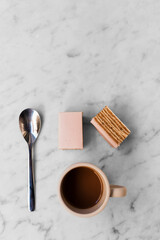 Pink cafe and coffee on white marble table