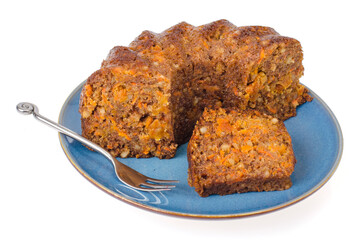 Piece of carrot cupcake on plate isolated on white