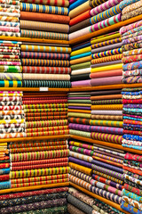 Shopping in the Grand Bazar. Traditional Turkish fabrics in souvenir shop. Handmade fabrics in Grand Bazaar.