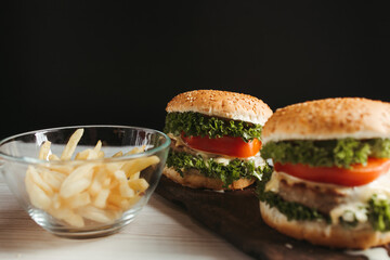Close-up home made hamburgers on wooden plate