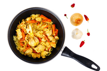 Pilaf. Rice with meat and vegetables in frying pan on white background. Studio Photo