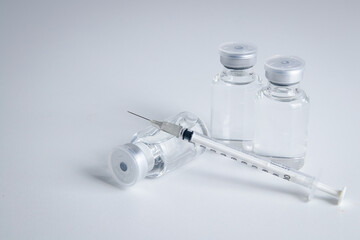 Anti-virus vaccine bottle with syringe Placed on a white background Concept of vaccine for the...
