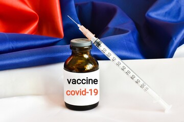 Vaccine and syringe injection in Russia Flag background. Prevention, immunization and treatment...