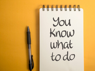 You know what to do, text words typography written on book against yellow background, life and...