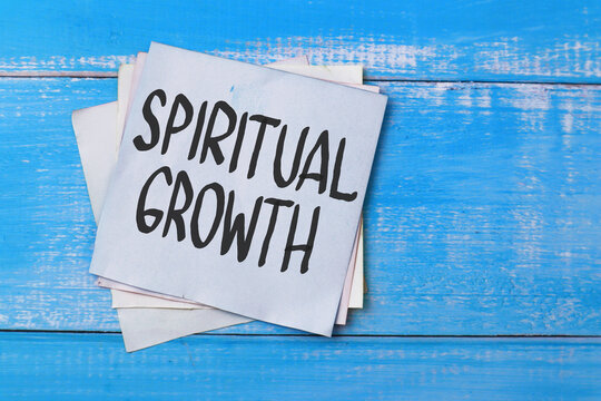 Spiritual Growth, text words typography written on book against blue background, life and business motivational inspirational