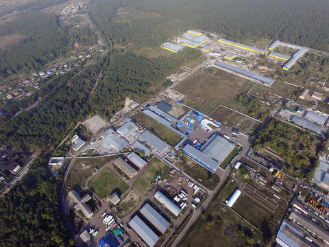 Aerial view of the saburb landscape (drone image).Business and industrial area in the forest. Near Kiev, Ukraine