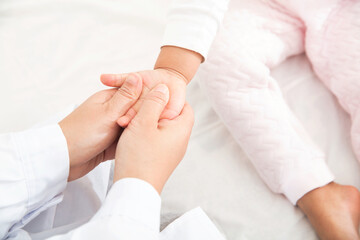 Doctors massage hands for pediatric patients