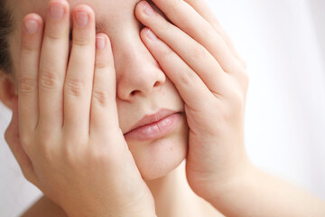 Teenage acne on the chin. Close up face with pimple. Teen problem. High quality photo.