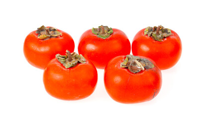 Heap of ripe sweet orange persimmons isolated on white background. Studio Photo