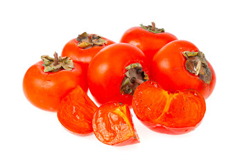 Heap of ripe sweet orange persimmons isolated on white background. Studio Photo