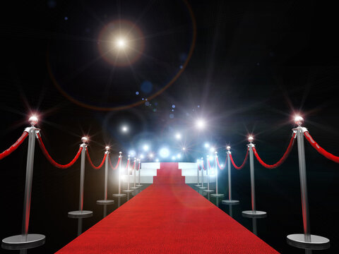 Red Carpet Amidst Bollards Against Illuminated Lights