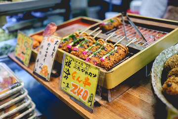 Traditional japanese fried skewers at Nishiki Market in Kyoto, Japan