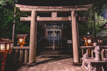 Fotobehang Girl and rabbit statue, stone torii gate and little shinto altar with bell and wooden lamps at Yasaka shrine in night, Kyoto, Japan © Samuel Ponce