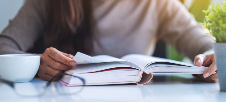 Closeup image of a woman reading book
