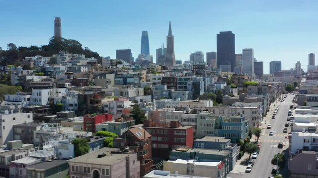 San Francisco, CA, USA. Dense buildings area with narrow streets and lanes. High and low built along steep hills with blue skies in the background. High quality 4k footage