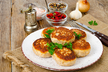 Homemade meat cutlets on wooden table. Studio Photo