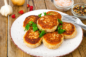 Homemade meat cutlets on wooden table. Studio Photo
