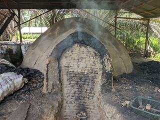 a charcoal-making furnace in South Kalimantan