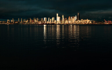 View of the city of Seattle over the Puget sound as seen from Alki Beach in West Seattle